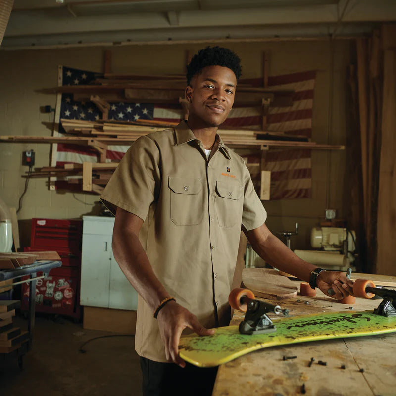 Person wearing a shirt in a workshop